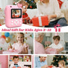 A woman is giving a pink instant print camera gift to a child, with various wrapped presents visible.
