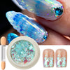 Iridescent opal and mermaid chrome nail glitter pigment set featuring blue iridescent nail polish and a loose pigment powder.