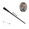 A long, slender metal magic wand with a dark handle and a decorative tip, shown next to a man's portrait.