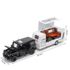 A black diecast metal RV camper truck model with an open roof, displayed on a white background.