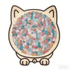 A jigsaw puzzle featuring many small cats arranged in a circular pattern on a wooden cat shape.