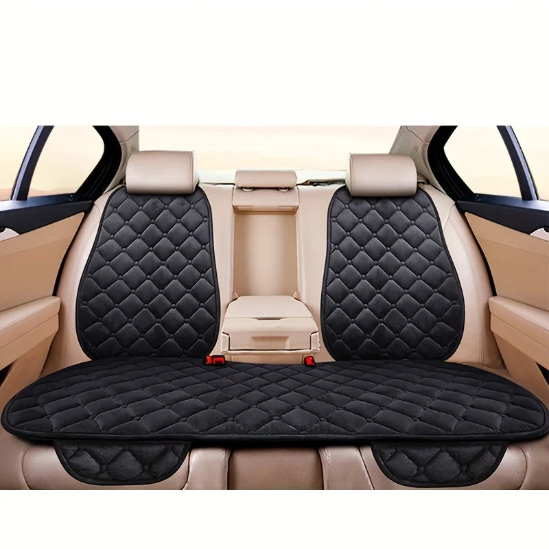 Interior view of a car seat with three plush anti-slip cushions for winter warmth