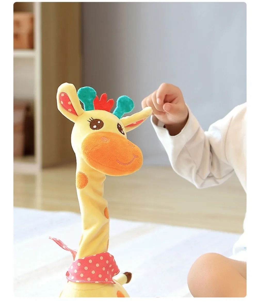 A yellow dancing talking giraffe plush toy is being held by a child.