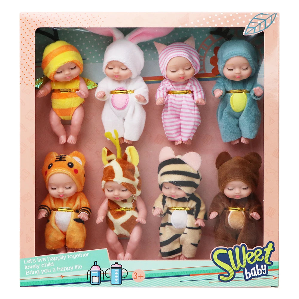 A set of realistic mini reborn baby dolls dressed in various outfits and presented in a box.