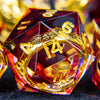 A close-up of a translucent red resin die with golden elven numbers, set against a dark background.