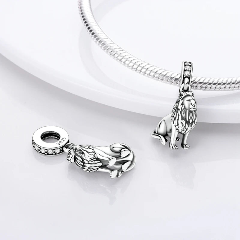 Sterling silver lion charm bead with a bail and a textured design