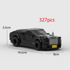 A black classic supercar model built from LEGO bricks, shown in a side profile with dimensions.