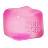 A translucent pink squishy cube fidget toy with the text NEED DIY molded into its surface.