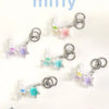 A collection of Miffy dream keychains featuring a white rabbit charm and a pink and blue star-shaped pendant.