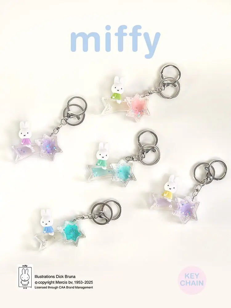 A collection of Miffy dream keychains featuring a white rabbit charm and a pink and blue star-shaped pendant.