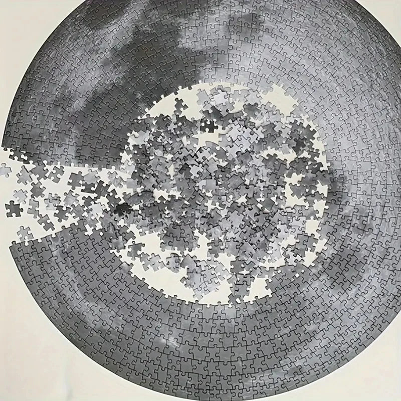 A 1000-piece jigsaw puzzle depicting a gray and white celestial scene.
