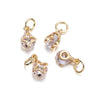 Gold and silver rhinestone heart charms for jewelry making displayed on a white background