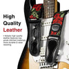 A black leather guitar strap featuring a floral pattern, complete with picks and locking mechanisms.