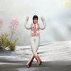 A plush doll of Elvis Presley Cat King in a white and red outfit standing on a snowy surface.