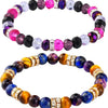 A bracelet made of colorful crystal rondelle spacer beads in various shades of purple, pink, and amber.