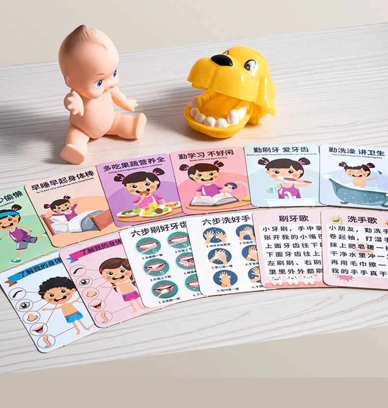 A set of colorful plastic toys featuring a baby figure and a dog, along with various cards for learning medical concepts.
