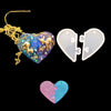 A heart-shaped silicone mold with a glittery blue and purple design and a separate white frame mold.