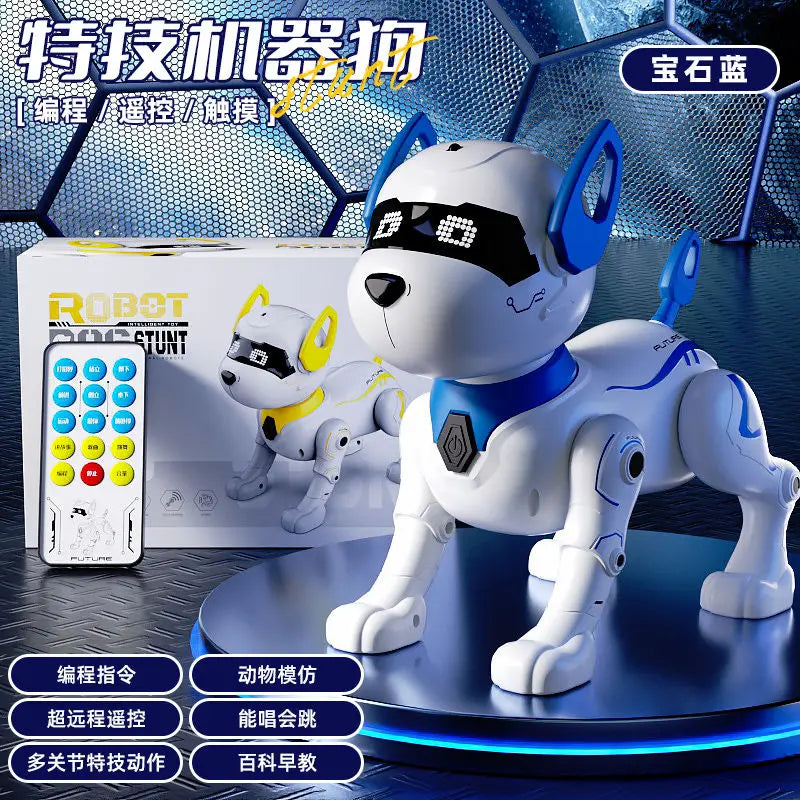 A white and blue robotic dog is displayed on a stand next to its remote control and a smaller version.