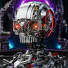 A detailed mechanical skeleton head building kit with silver and red LED lights displayed on a dark surface.