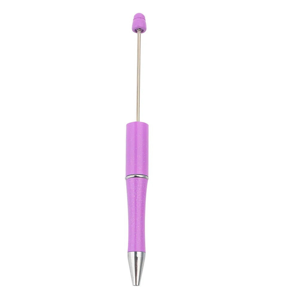 A purple beadable ballpoint pen with a silver tip and gold-colored clip.