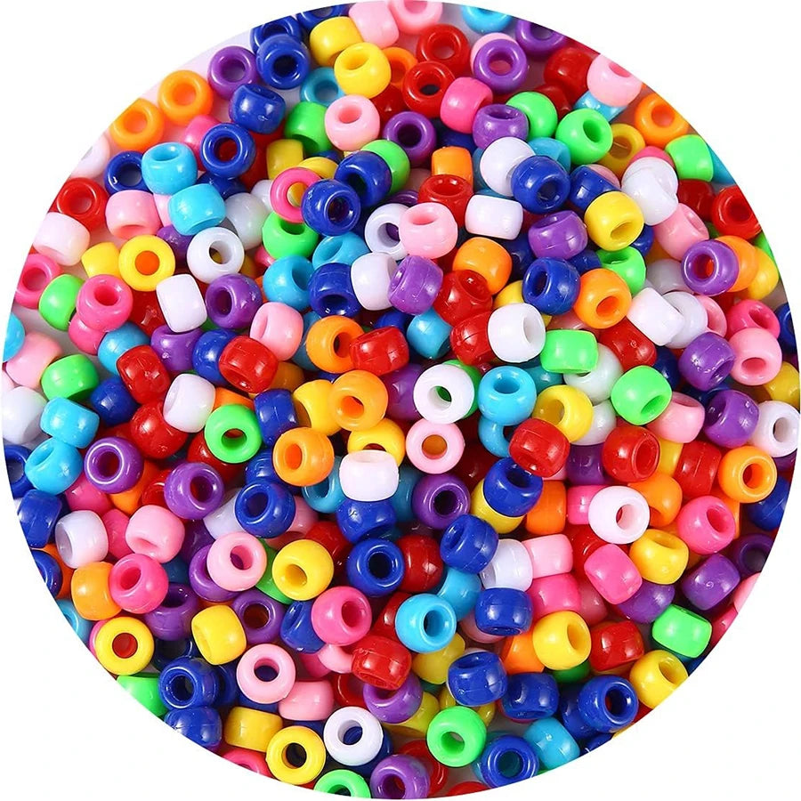 A circular arrangement of colorful pony beads in various shades including pink, yellow, blue, and red.