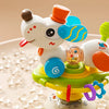 A white cartoon baby rattle toy shaped like a cow, featuring various colorful parts and suction cups on a light background.
