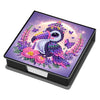 A leather diamond painting kit box featuring a vibrant illustration of a colorful bird against a purple and gold background.