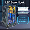An LED Book Nook model kit featuring a wooden miniature with an internal light display and various decorative elements.