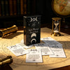 A deck of Spirit Messages Oracle Cards is displayed on a parchment with divination symbols and tools.