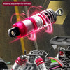 Close-up of a hydraulic threaded shock absorber design on an RC monster truck suspension system.