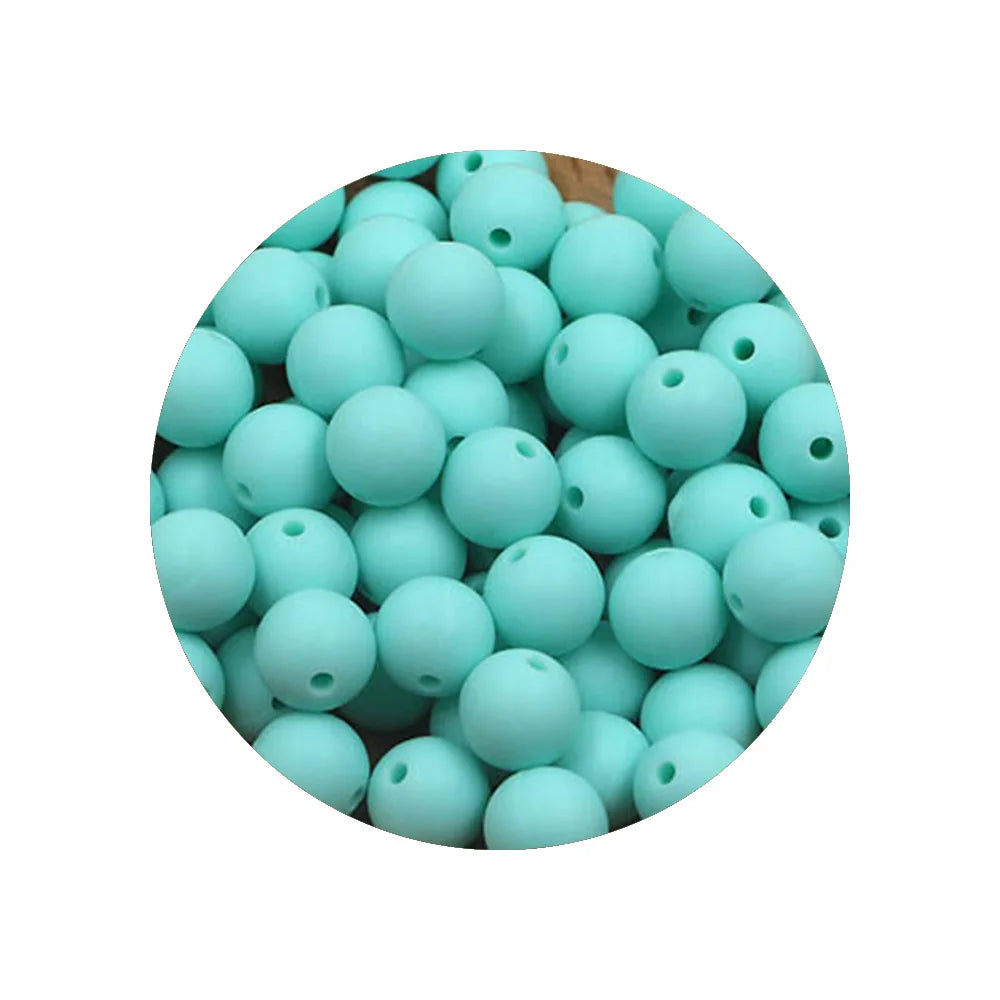 A circular arrangement of light blue silicone beads for DIY jewelry making.