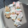 A collection of cute monchhichi plush keychains in various shades of pink and beige.