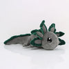A soft gray and green plush toy of an axolotl with leafy accents.