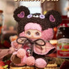 A fluffy strawberry Oreo themed blind box plush charm featuring a bear face and pink accents.