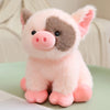 A pink and gray plush pig stuffed animal with large ears and a pink snout.
