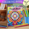 A colorful mandala coloring book with pencils and art supplies displayed on a wooden surface.