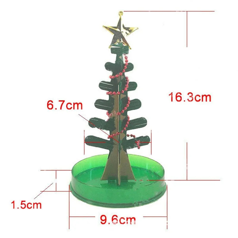 A small, dark green crystal growing tree decoration with a gold star topper and a green base.