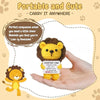 A hand holds a small crocheted yellow lion doll with a positive message card.