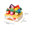 A colorful sensory toy box featuring soft pulling carrot toys and various fabric shapes for babies.