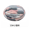 A round ball of soft, fluffy chenille yarn in a mottled pattern of gray, pink, and white.