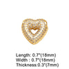 A gold-toned crystal heart pendant with a pave setting and a textured surface.