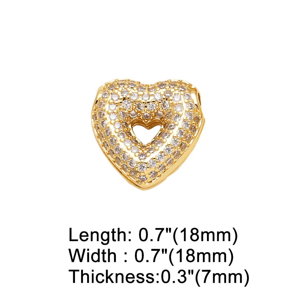A gold-toned crystal heart pendant with a pave setting and a textured surface.