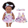 A 12-inch realistic African American baby doll with a curly hairstyle and a purple floral dress.