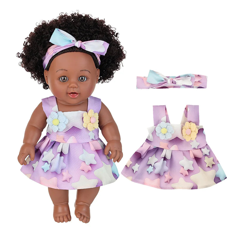 A 12-inch realistic African American baby doll with a curly hairstyle and a purple floral dress.