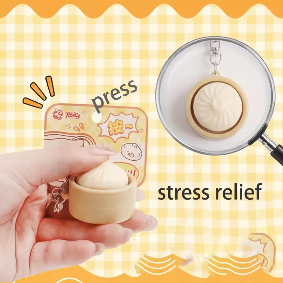 A hand is pressing a light-colored dumpling stress relief item onto a white plate.