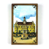 A vintage-style Lenormand oracle card featuring a watercolor illustration of a yellow building with a clock tower under a blu