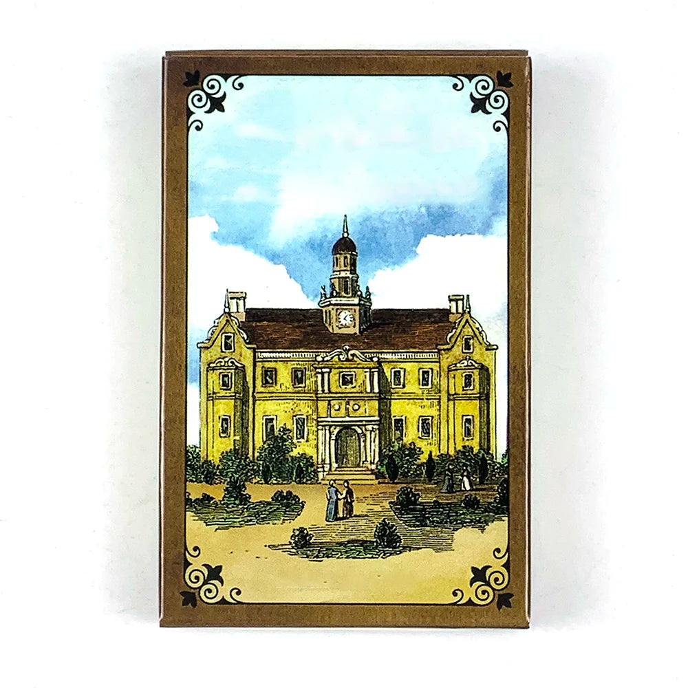 A vintage-style Lenormand oracle card featuring a watercolor illustration of a yellow building with a clock tower under a blu