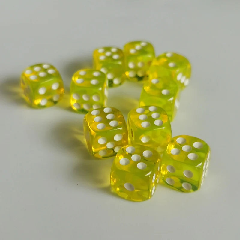 A collection of bright yellow transparent dice arranged in a loose cluster on a white surface.