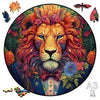 A circular jigsaw puzzle featuring a detailed, colorful painting of a lion's head.