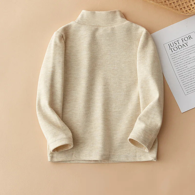 A beige kids fleece-lined long sleeve t-shirt with bear embroidery displayed on a neutral background.